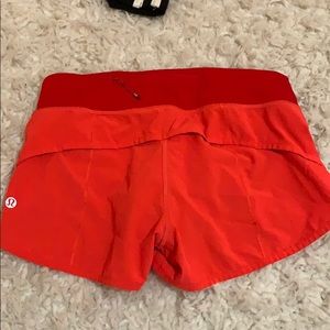 Coral colored lululemon speed shorts